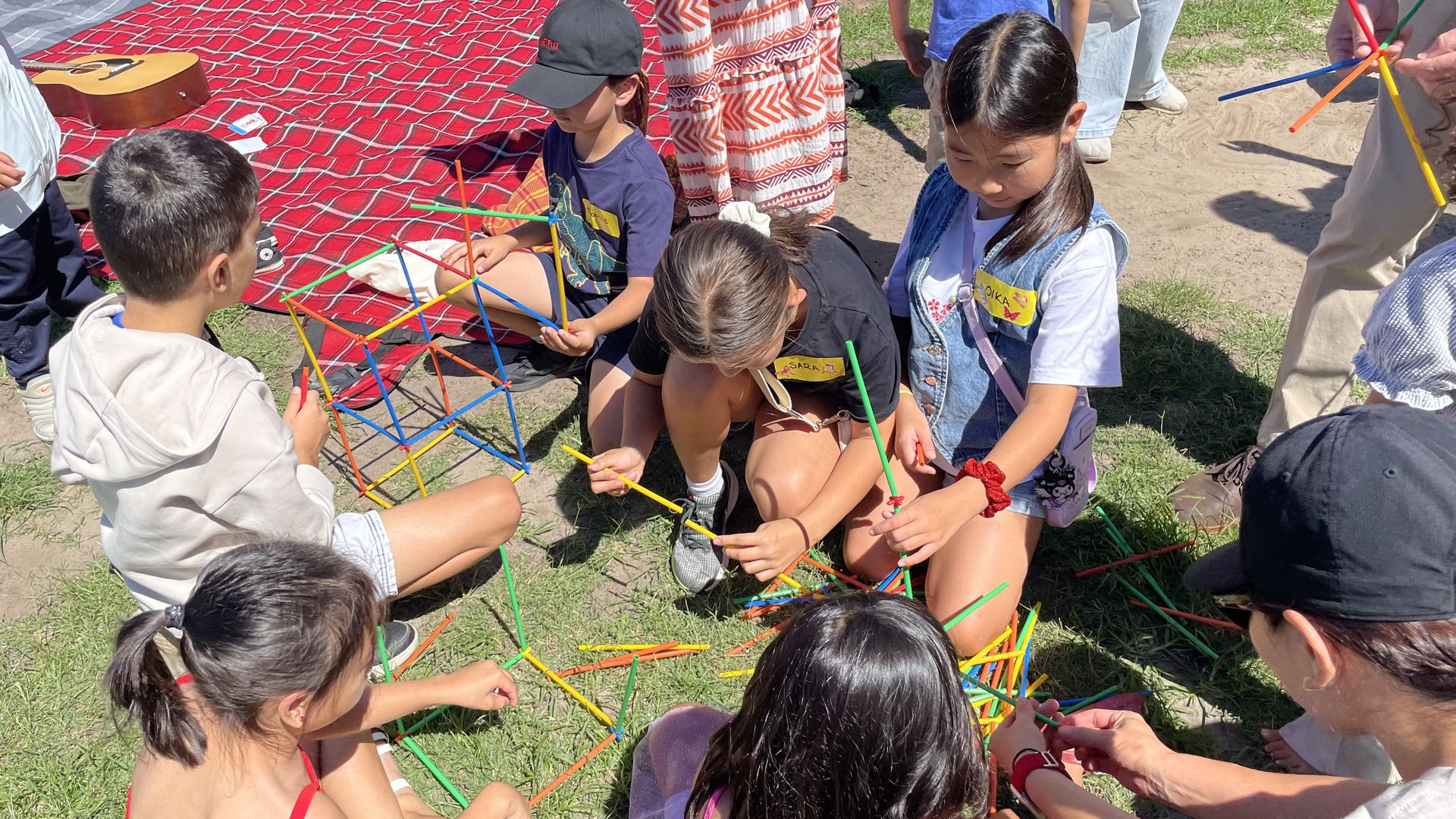 Children working together on a colourful outdoor construction