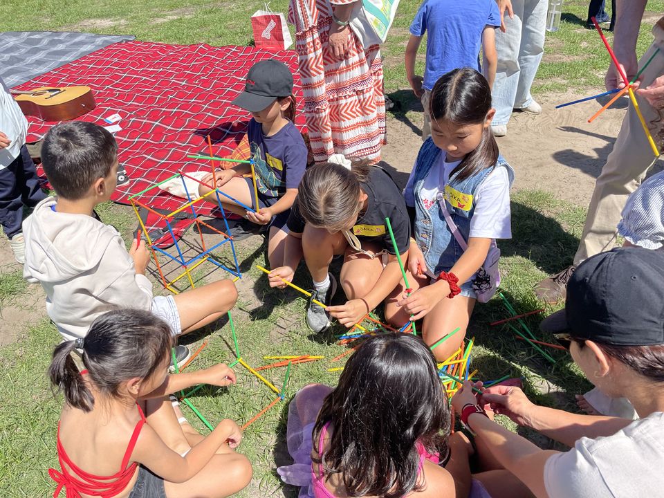 Children working together on a colourful outdoor construction