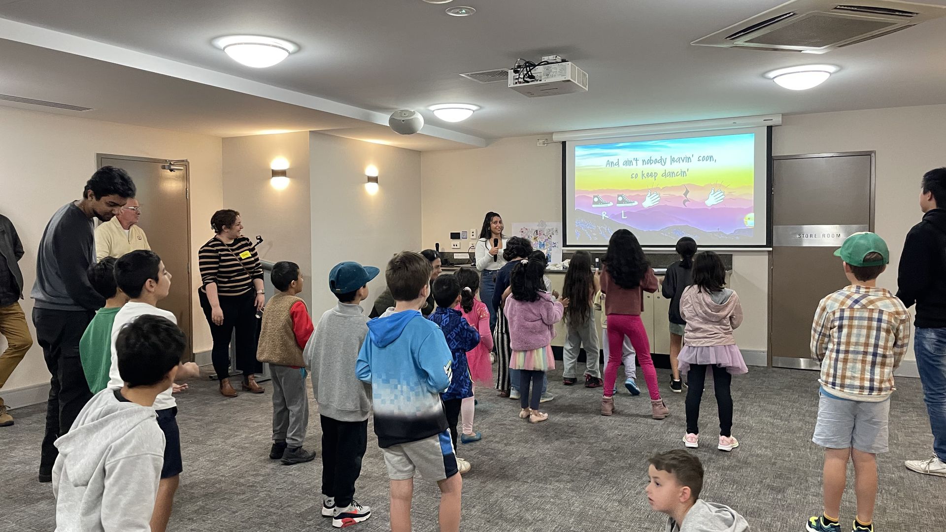 Children taking part in a joyful group song and movement session